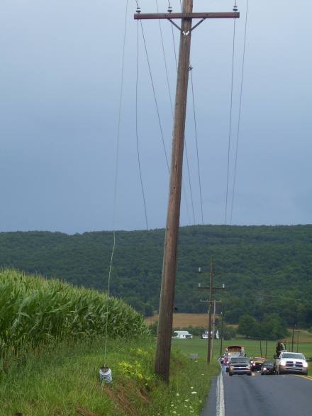Pole with wires on the ground