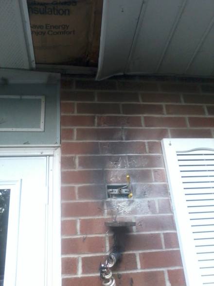Up close look at porch light after fire was extinguished